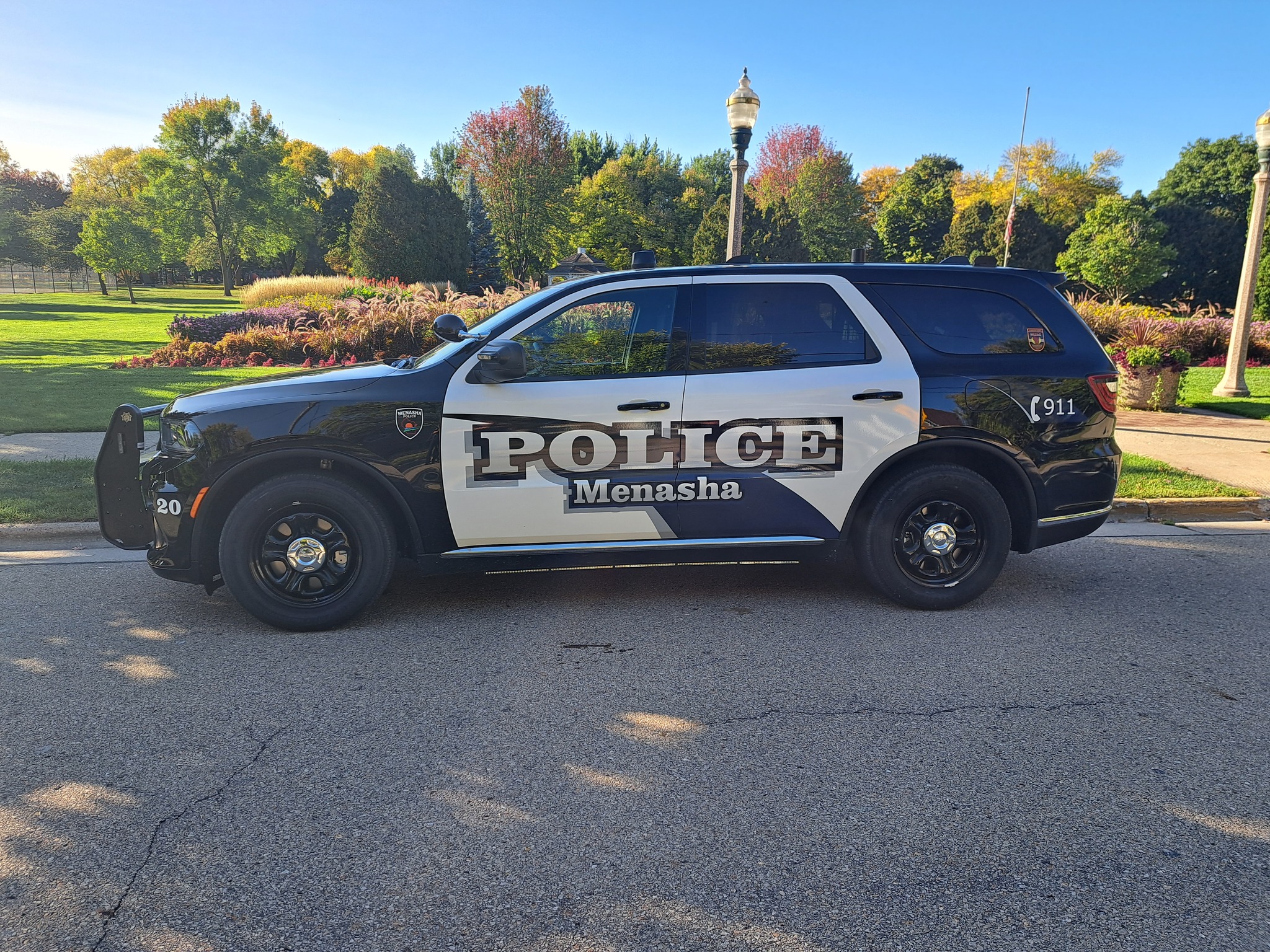 Image of the side of a Menasha Police Department squad car.