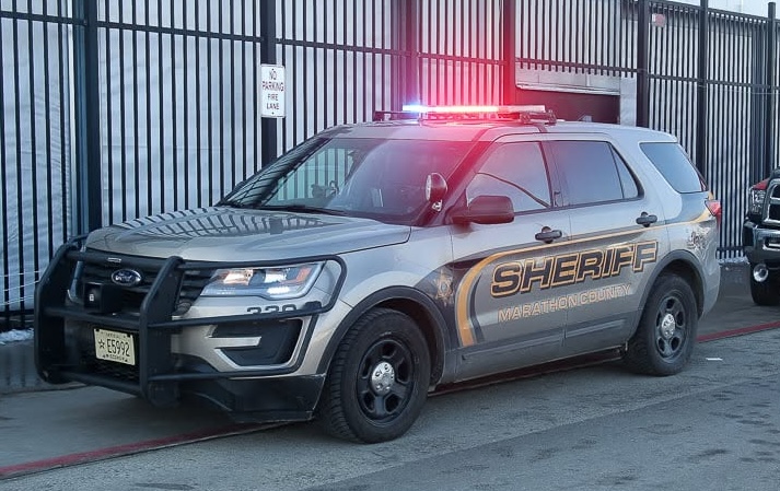 Photo of Marathon County Sheriff's Office squad car with emergency lights activated.